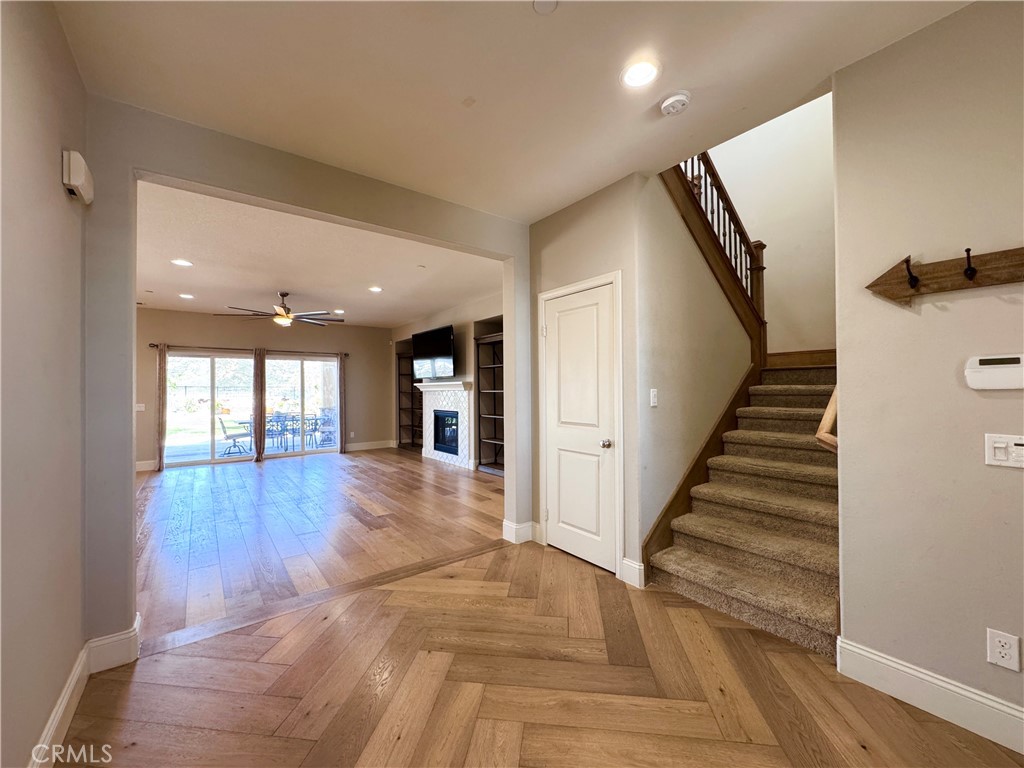 17841 Grapevine Lane San Bernardino, CA 92407 - Photo 14 of 63 a view of entryway and hall with wooden floor