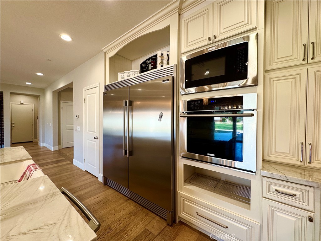 17841 Grapevine Lane San Bernardino, CA 92407 - Photo 20 of 63 a kitchen with stainless steel appliances granite countertop a refrigerator and a stove top oven