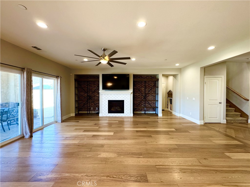 17841 Grapevine Lane San Bernardino, CA 92407 - Photo 23 of 63 a view of an empty room with wooden floor and a window