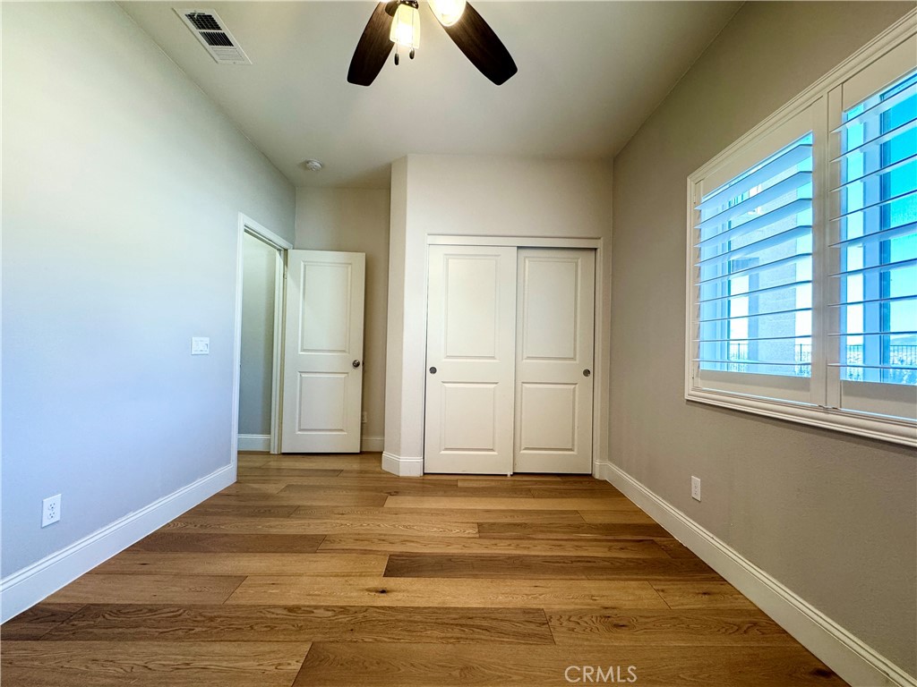 17841 Grapevine Lane San Bernardino, CA 92407 - Photo 28 of 63 a view of a livingroom with wooden floor and window