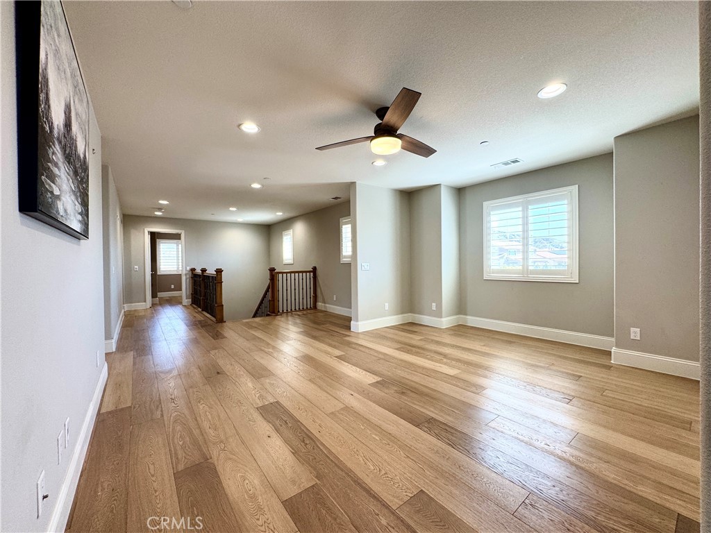 17841 Grapevine Lane San Bernardino, CA 92407 - Photo 37 of 63 a view of empty room with wooden floor and window