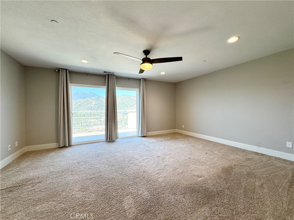 17841 Grapevine Lane San Bernardino, CA 92407 - Photo 40 of 63 an empty room with window and ceiling fan