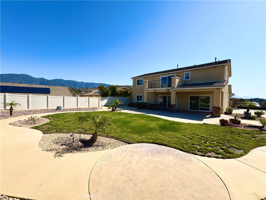 17841 Grapevine Lane San Bernardino, CA 92407 - Photo 4 of 63 a front view of a house with a yard