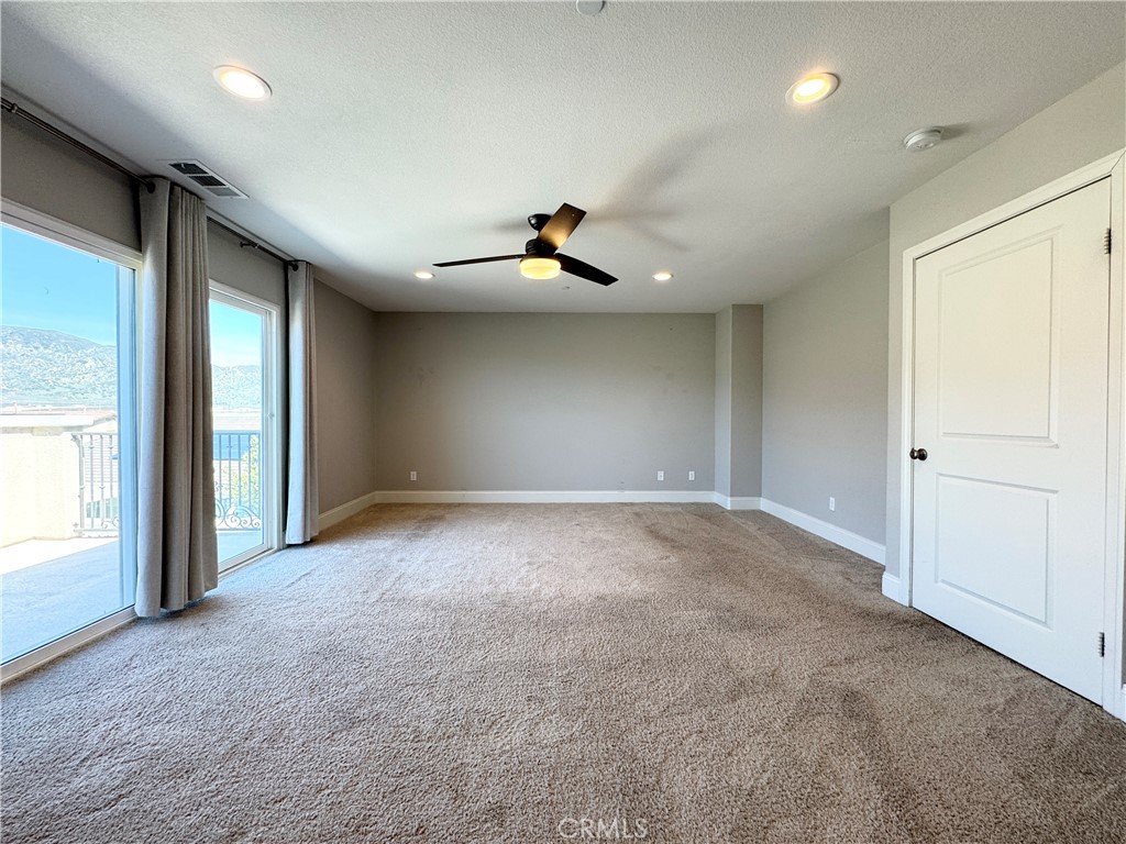 17841 Grapevine Lane San Bernardino, CA 92407 - Photo 42 of 63 an empty room with fan and windows