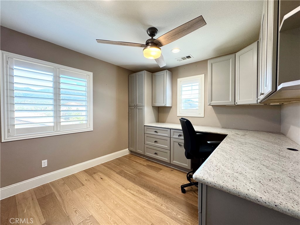 17841 Grapevine Lane San Bernardino, CA 92407 - Photo 52 of 63 a kitchen with granite countertop a sink cabinets stainless steel appliances and a window