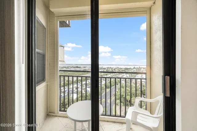 a view of a balcony with a floor to ceiling window