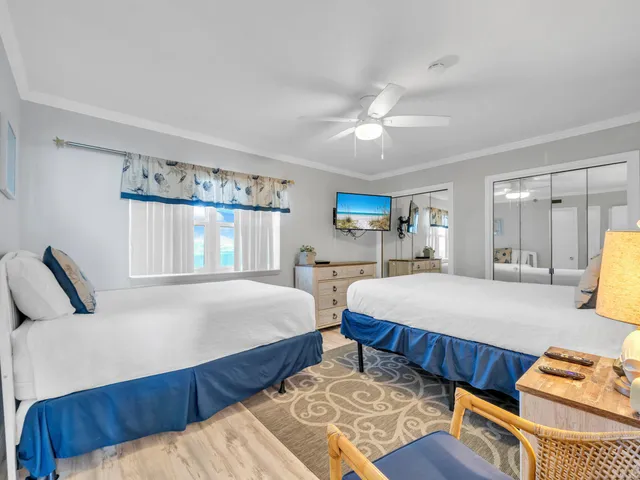 a bedroom with bed and window