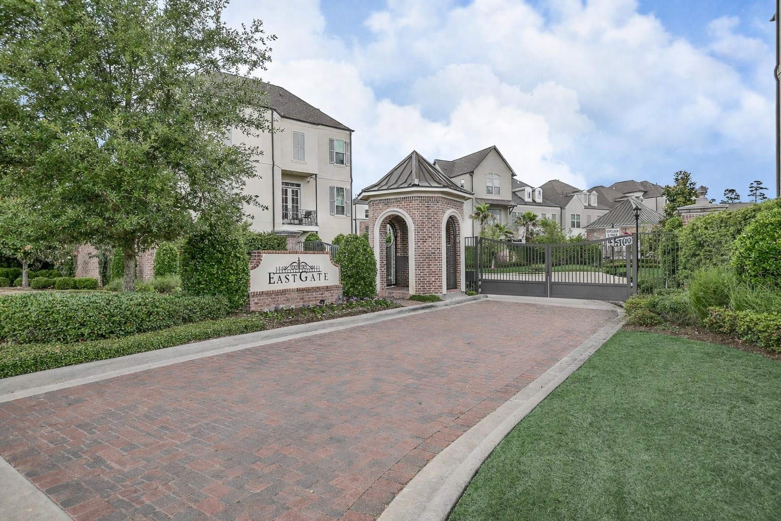122 Gateway Park Place Spring, TX 77380 - Photo 2 of 44 Arrive in style through Eastgate’s gated entrance, framed by brick paving and manicured landscaping.