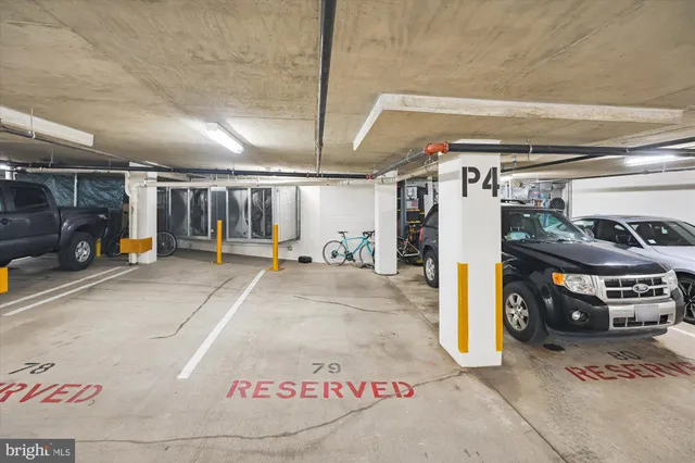 a view of parking garage with cars