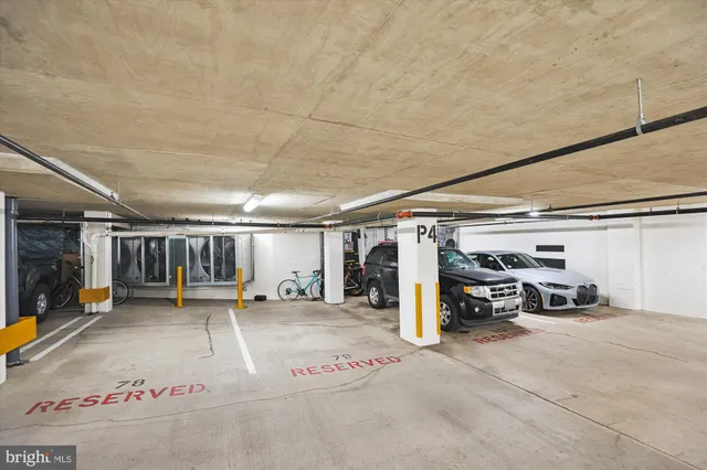 a view of parking garage with cars