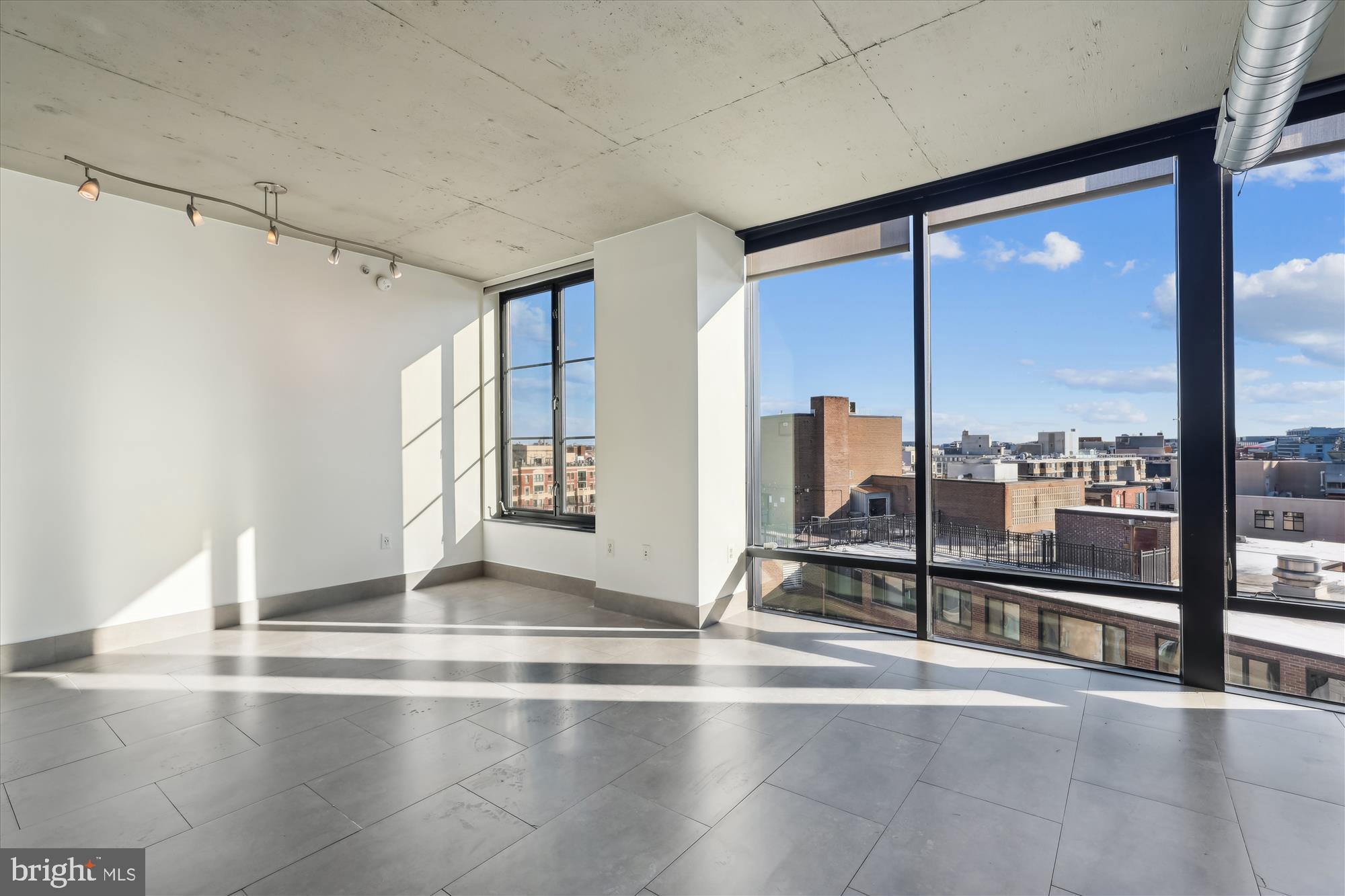 1133 14th Street Northwest, Unit 1209 Washington, DC 20005 - Photo 6 of 42 a view of empty room with wooden floor