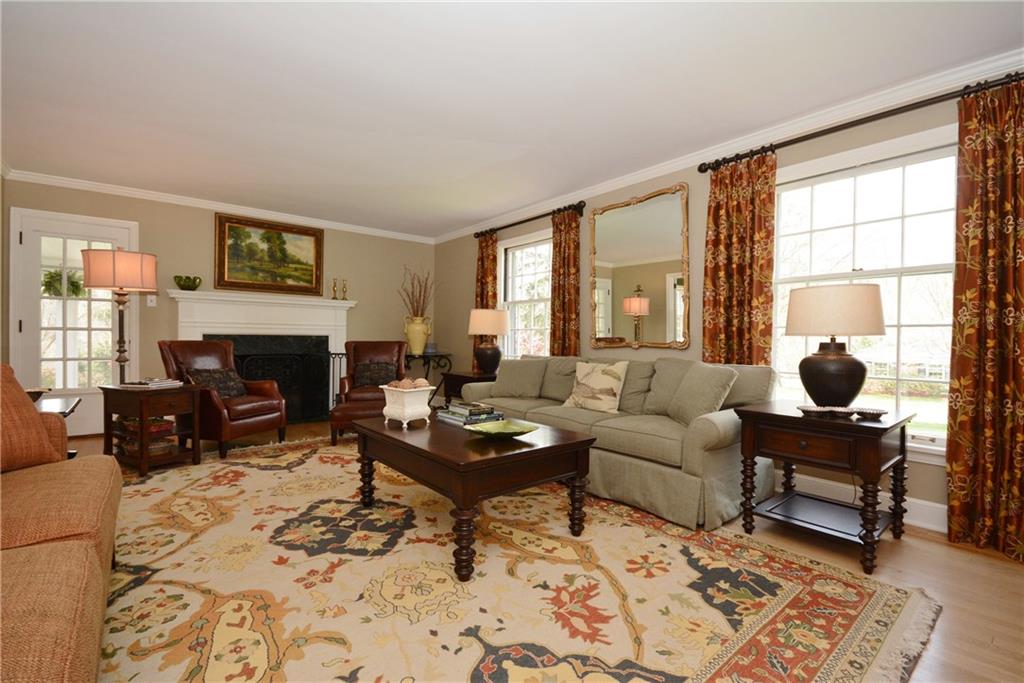 Abundant natural light and marble hearth. 