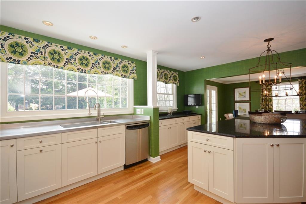 Granite counters with over-sized double sink with soaking basin. 