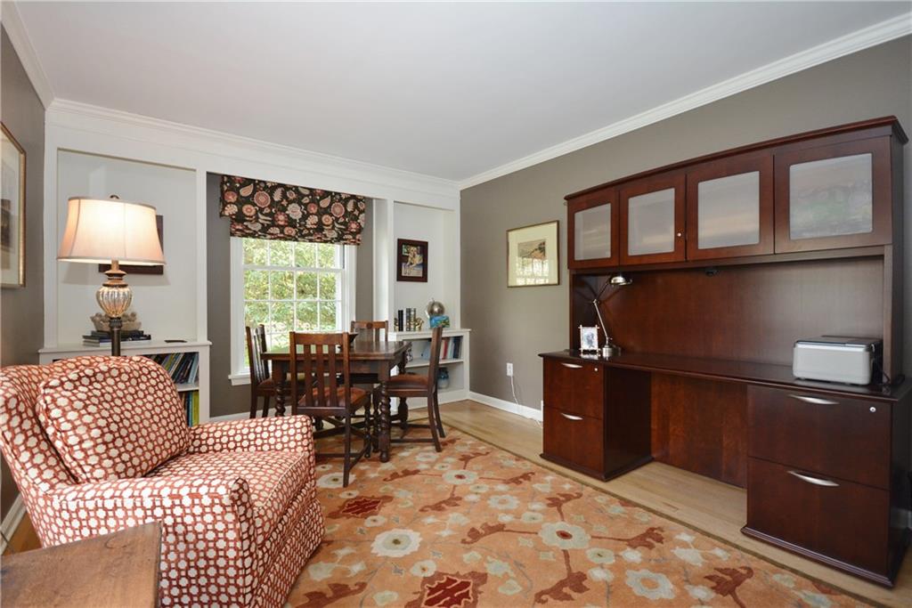 104 Hawthorne Road Fox Chapel, PA 15238 - Photo 9 of 24 Custom built-ins flank the window in the family room.