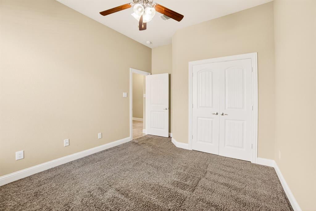 552 Winnetka Drive Oak Point, TX 75068 - Photo 11 of 40 an empty room with chandelier fan