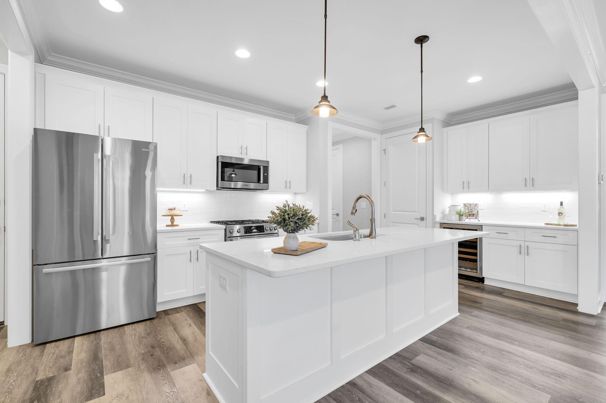 304 Windrow Way Inlet Beach Inlet Beach, FL 32461 - Photo 16 of 70 a kitchen with kitchen island white cabinets and stainless steel appliances