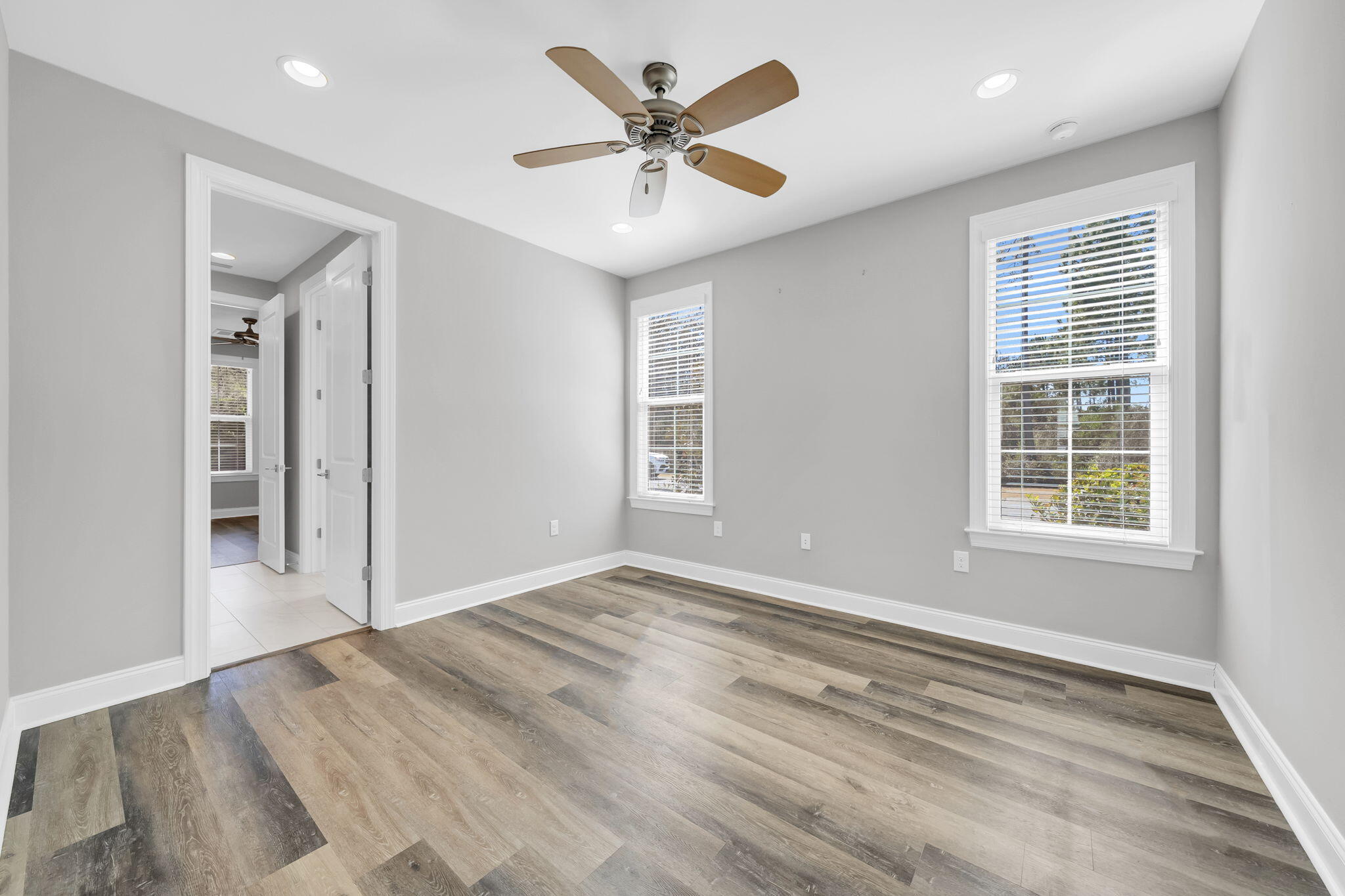 304 Windrow Way Inlet Beach Inlet Beach, FL 32461 - Photo 31 of 70 an empty room with chandelier fan and windows