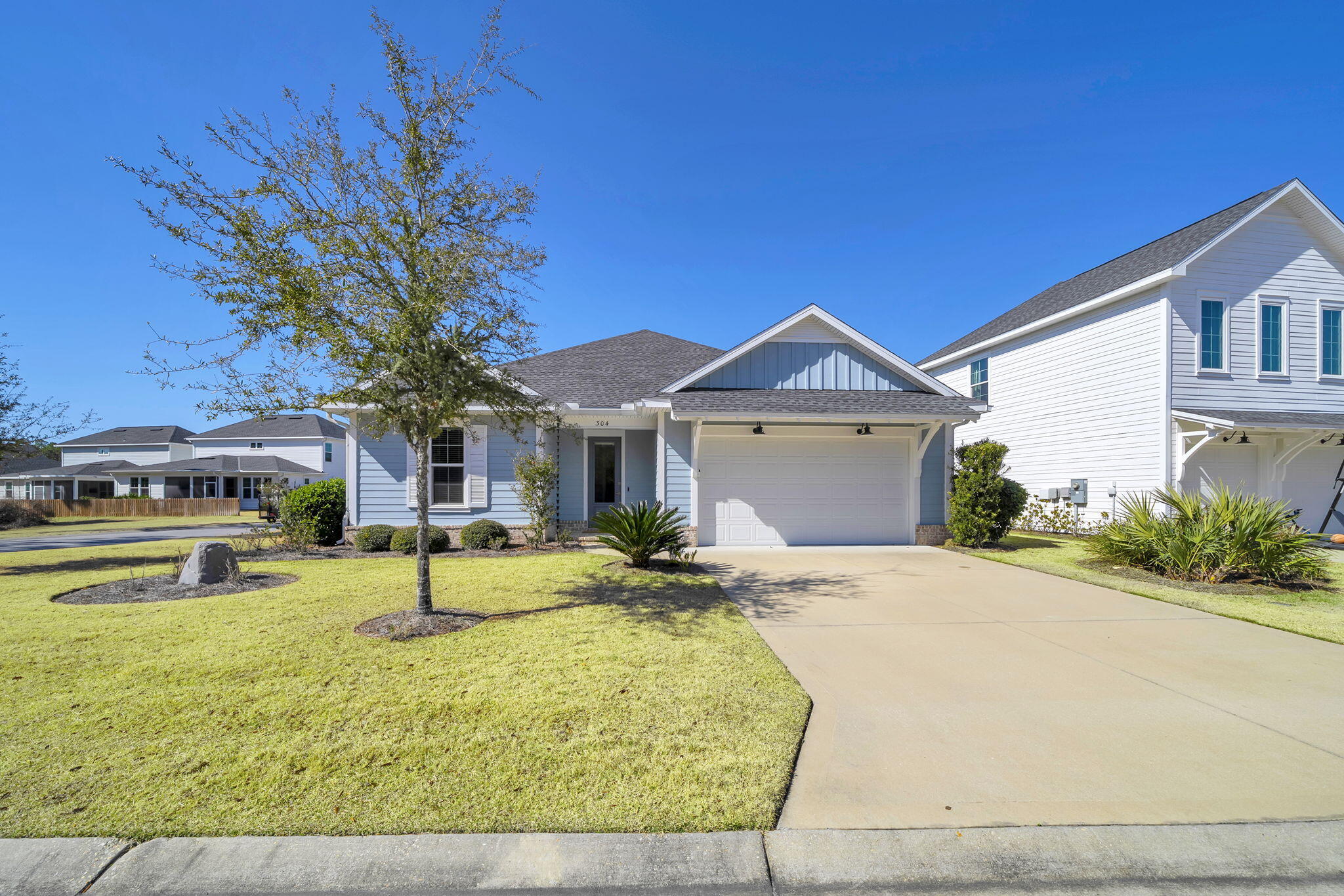 304 Windrow Way Inlet Beach Inlet Beach, FL 32461 - Photo 6 of 70 a front view of a house with a yard
