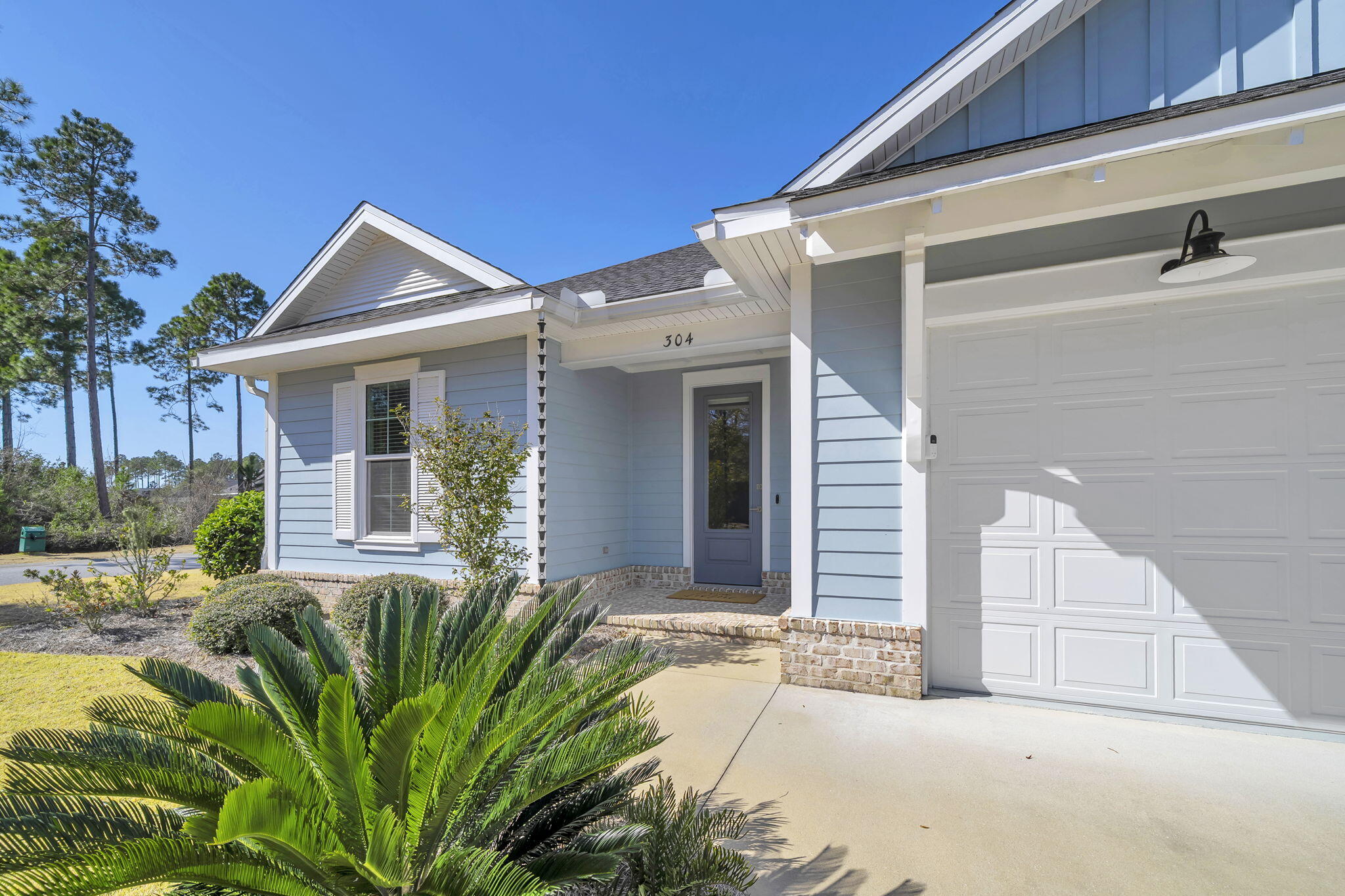 304 Windrow Way Inlet Beach Inlet Beach, FL 32461 - Photo 8 of 70 a front view of a house with garden