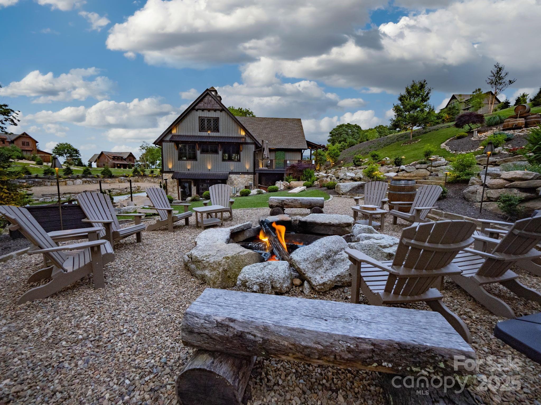 G-66 White Eagle Trail, Unit G66 Banner Elk, NC 28604 - Photo 21 of 24 a view of a chairs and table in the patio
