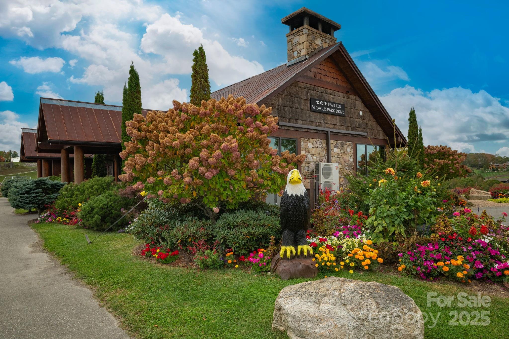 G-66 White Eagle Trail, Unit G66 Banner Elk, NC 28604 - Photo 22 of 24 a front view of a house with a yard