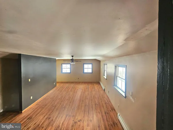 a view of a livingroom with wooden floor
