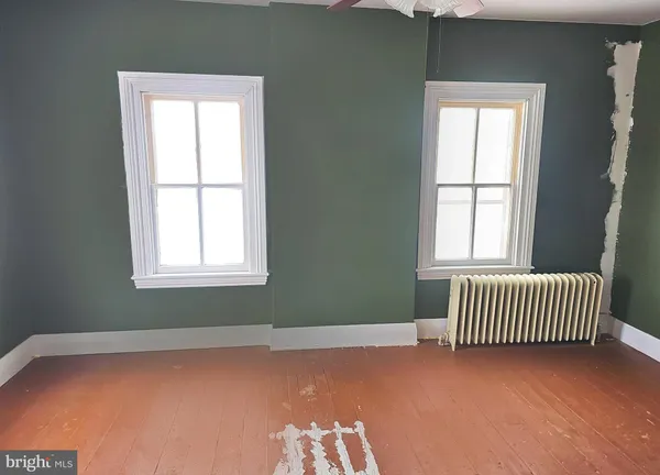 an empty room with windows
