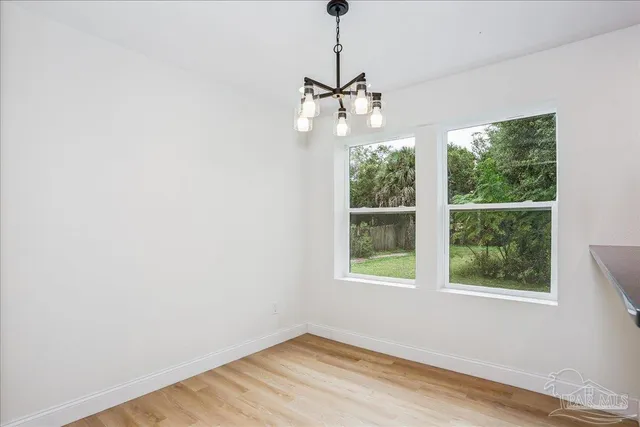 a kitchen with stainless steel appliances granite countertop a sink a stove top oven a counter space and cabinets