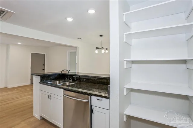 a bathroom with a double vanity sink and mirror