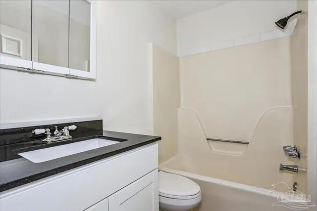 a house view with swimming pool in front of it