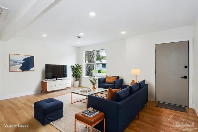 a view of a kitchen with wooden floor and a sink