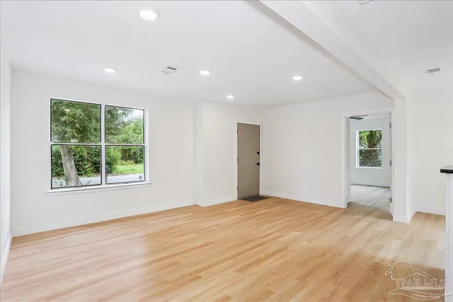 a kitchen with a refrigerator and window