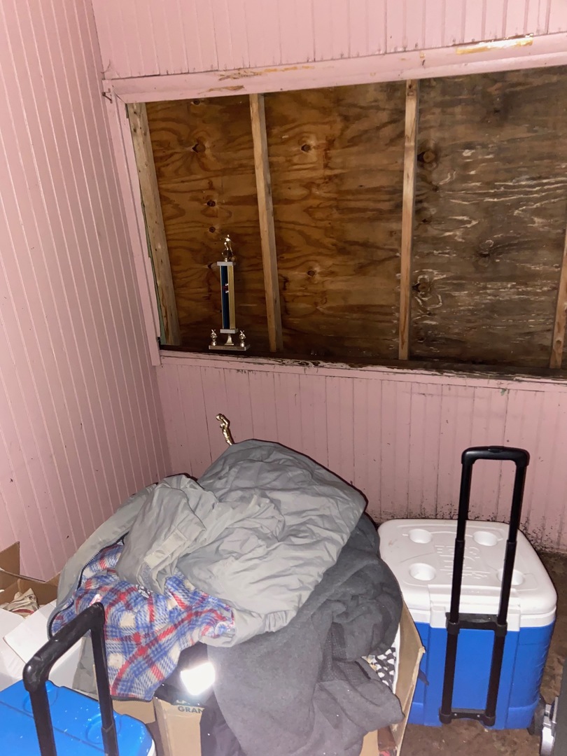 4022 West Cermak Road Chicago, IL 60623 - Photo 15 of 15 a bedroom with a bed and a chair with the wooden floor