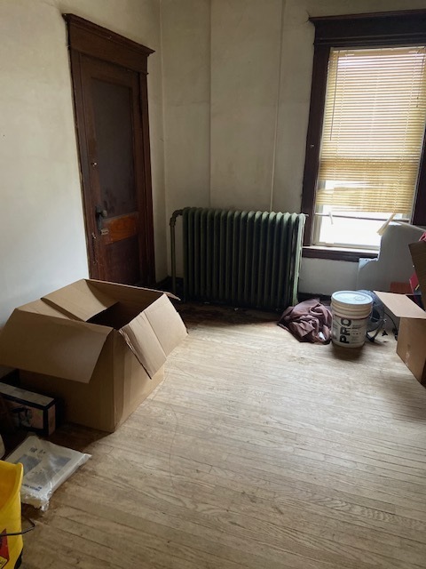 4022 West Cermak Road Chicago, IL 60623 - Photo 5 of 15 a bedroom with a bed window and a chair