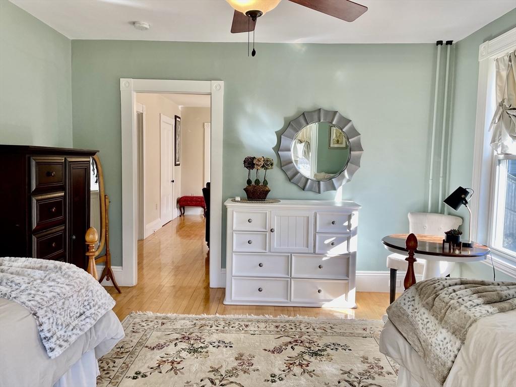 55 Linebrook Road, Unit 1 Ipswich, MA 01938 - Photo 13 of 25 a bedroom with a bed and a dresser in it