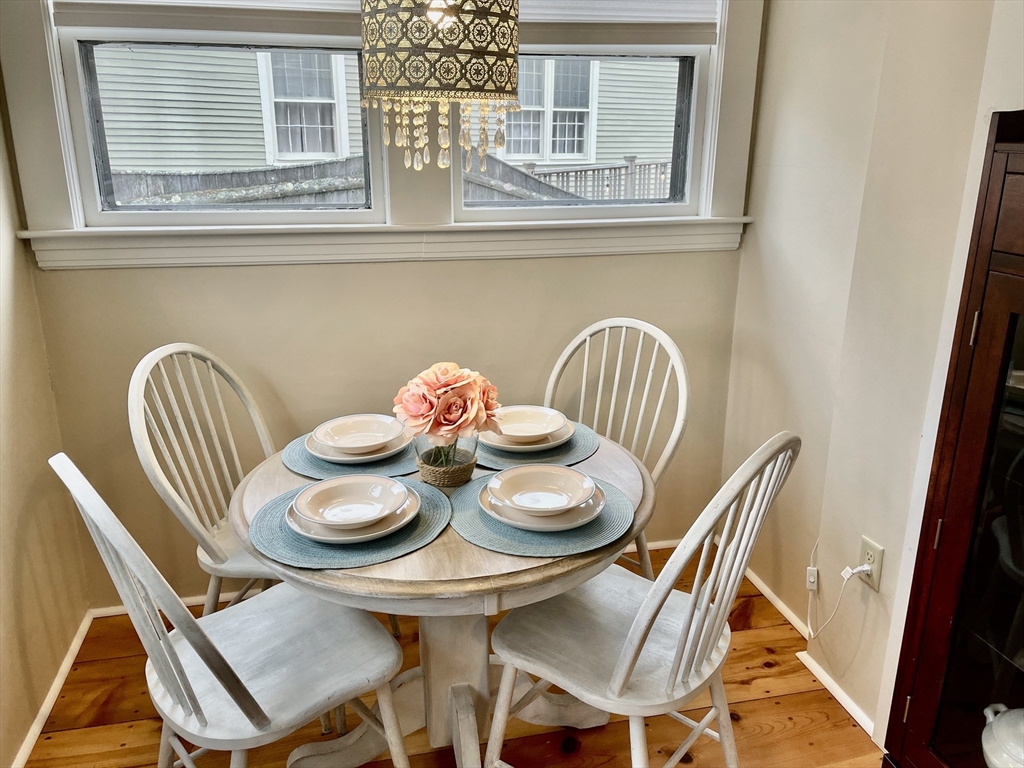 55 Linebrook Road, Unit 1 Ipswich, MA 01938 - Photo 14 of 25 a dining room with furniture and window