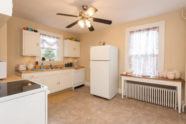 a white refrigerator freezer and a dishwasher in a kitchen