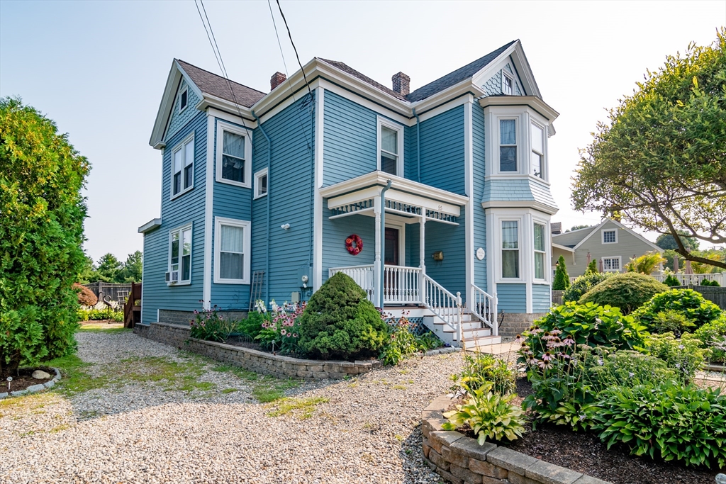 55 Linebrook Road, Unit 1 Ipswich, MA 01938 - Photo 2 of 25 a front view of a house with garden