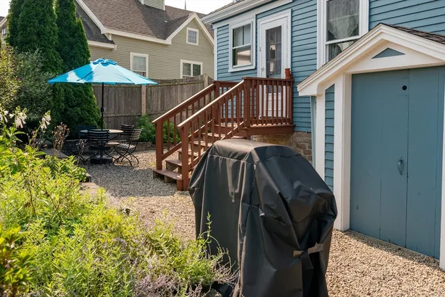 a view of a backyard with potted plants