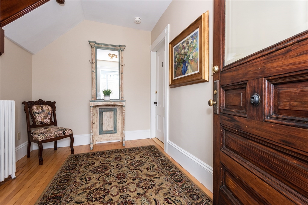 55 Linebrook Road, Unit 1 Ipswich, MA 01938 - Photo 3 of 25 a view of a hallway with wooden floor and windows