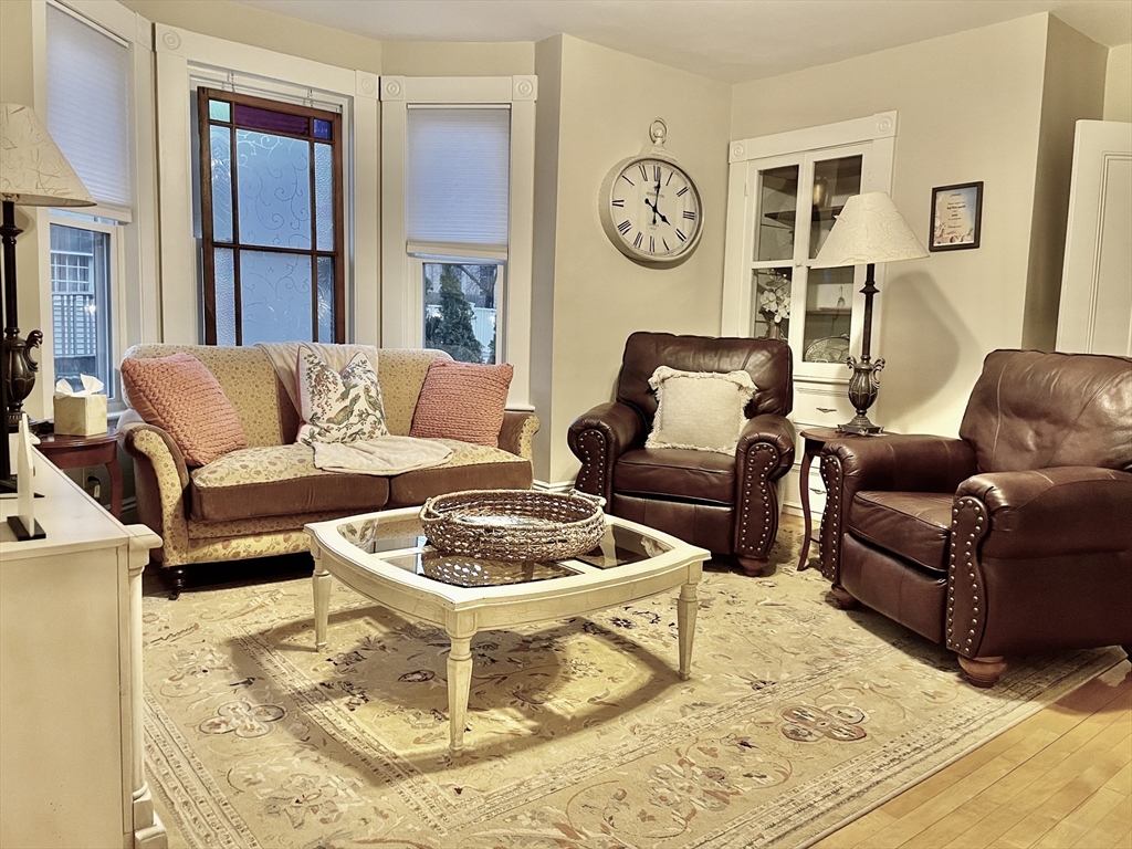 55 Linebrook Road, Unit 1 Ipswich, MA 01938 - Photo 5 of 25 a living room with furniture and window