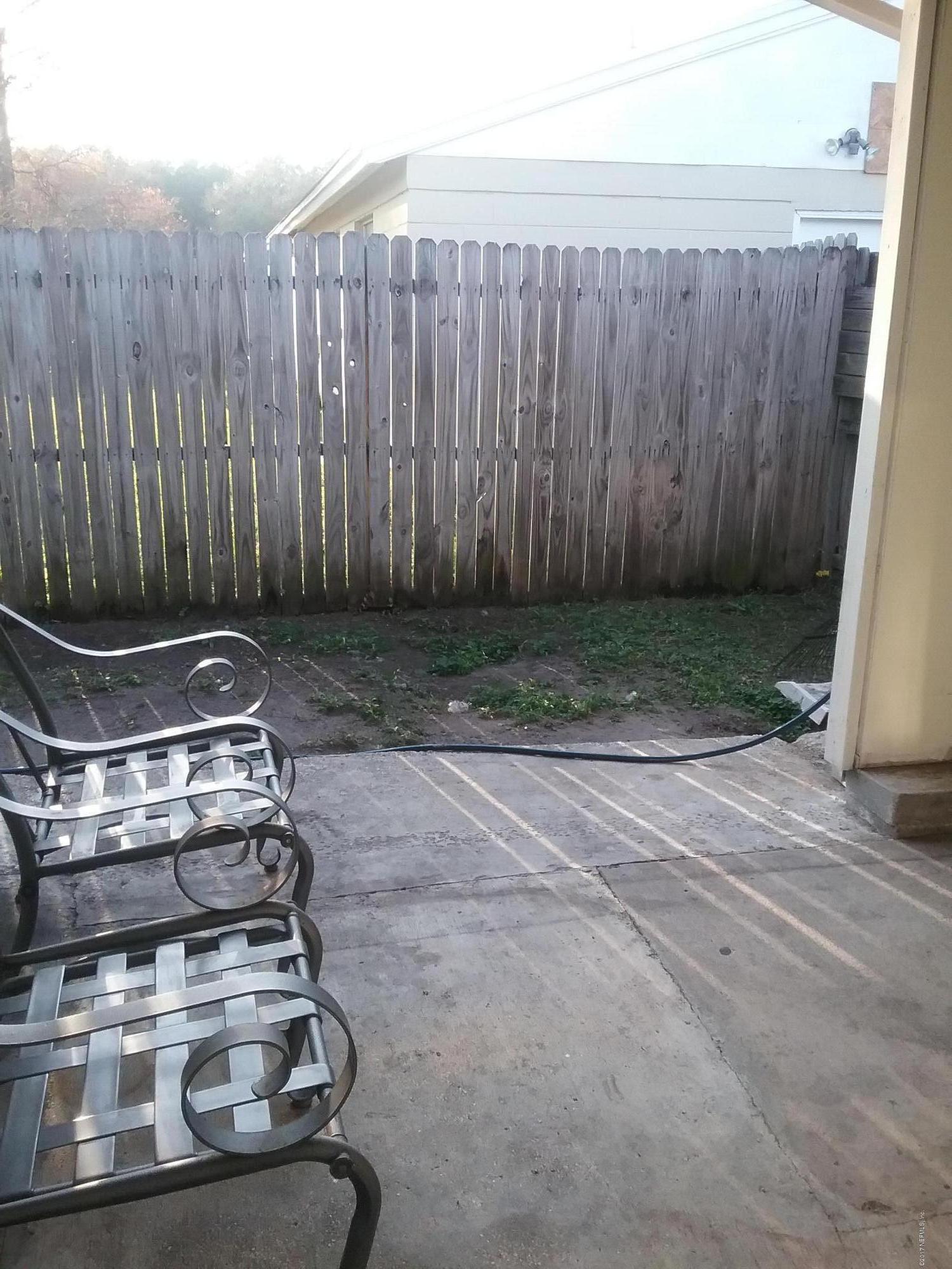 8248 Spring Lake Road North Jacksonville, FL 32210 - Photo 22 of 24 Side porch