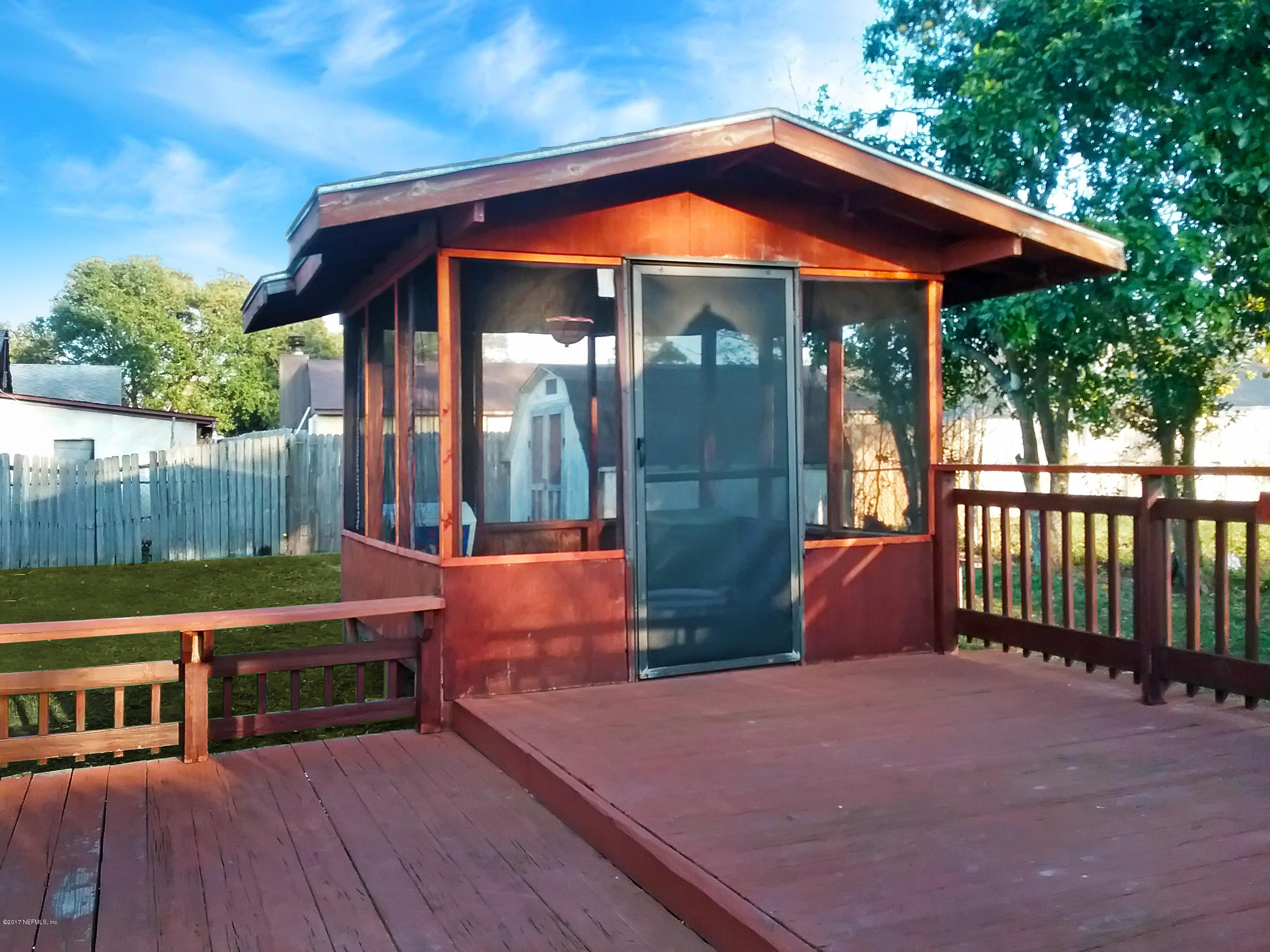 8248 Spring Lake Road North Jacksonville, FL 32210 - Photo 4 of 24 Outside wooden deck