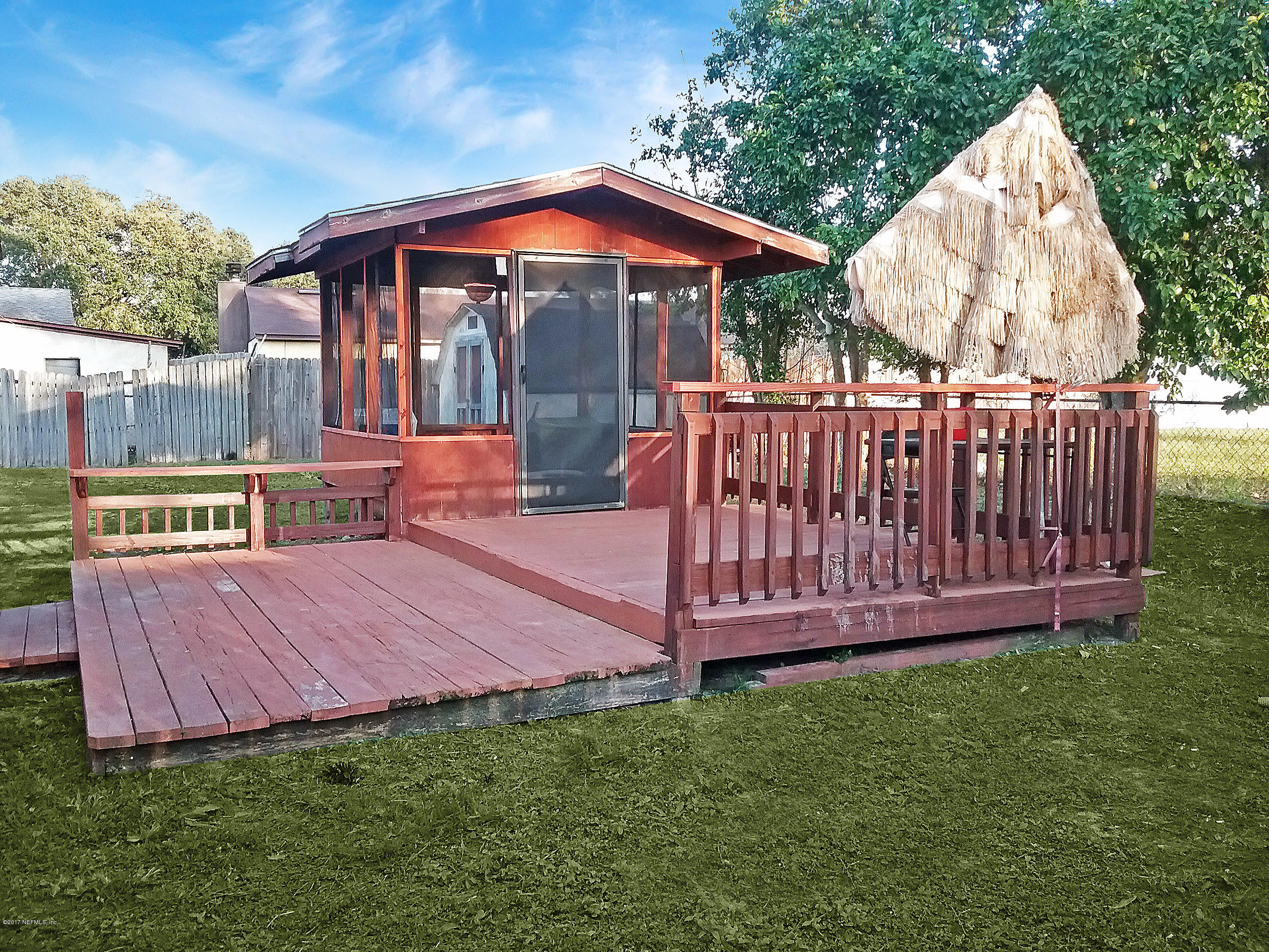 8248 Spring Lake Road North Jacksonville, FL 32210 - Photo 5 of 24 Outside wooden deck
