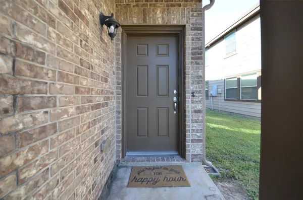 a view of a door and wooden floor