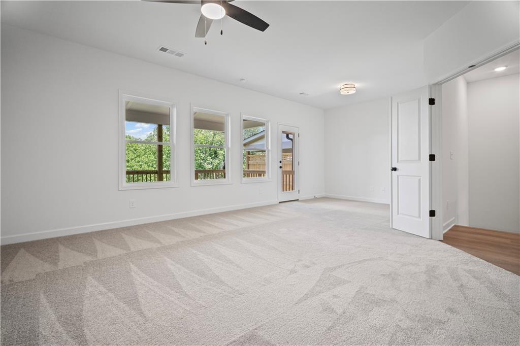 201 Retreat Lane Canton, GA 30114 - Photo 15 of 43 an empty room with windows and closet