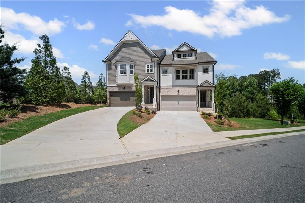 201 Retreat Lane Canton, GA 30114 - Photo 2 of 43 a front view of a house with a yard and garage