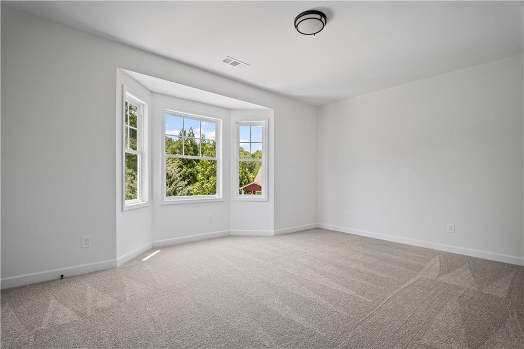 201 Retreat Lane Canton, GA 30114 - Photo 21 of 43 an empty room with windows