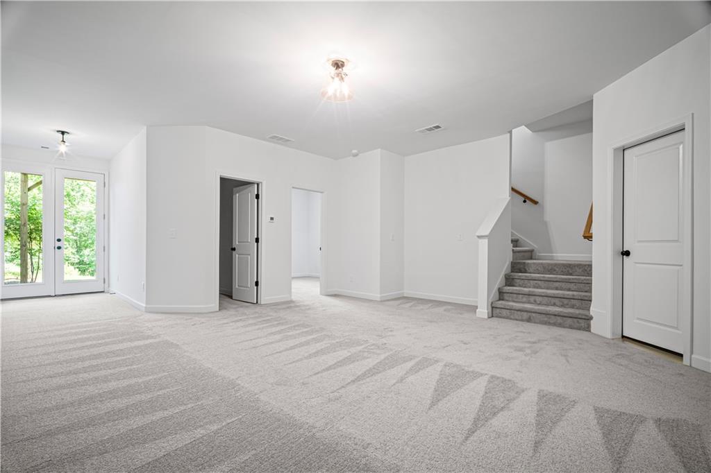 201 Retreat Lane Canton, GA 30114 - Photo 24 of 43 an empty room with a white walls and windows