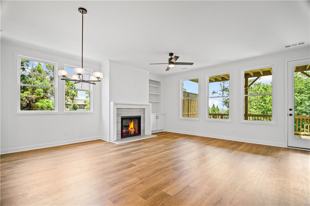 201 Retreat Lane Canton, GA 30114 - Photo 9 of 43 a view of livingroom with furniture flat screen tv and windows